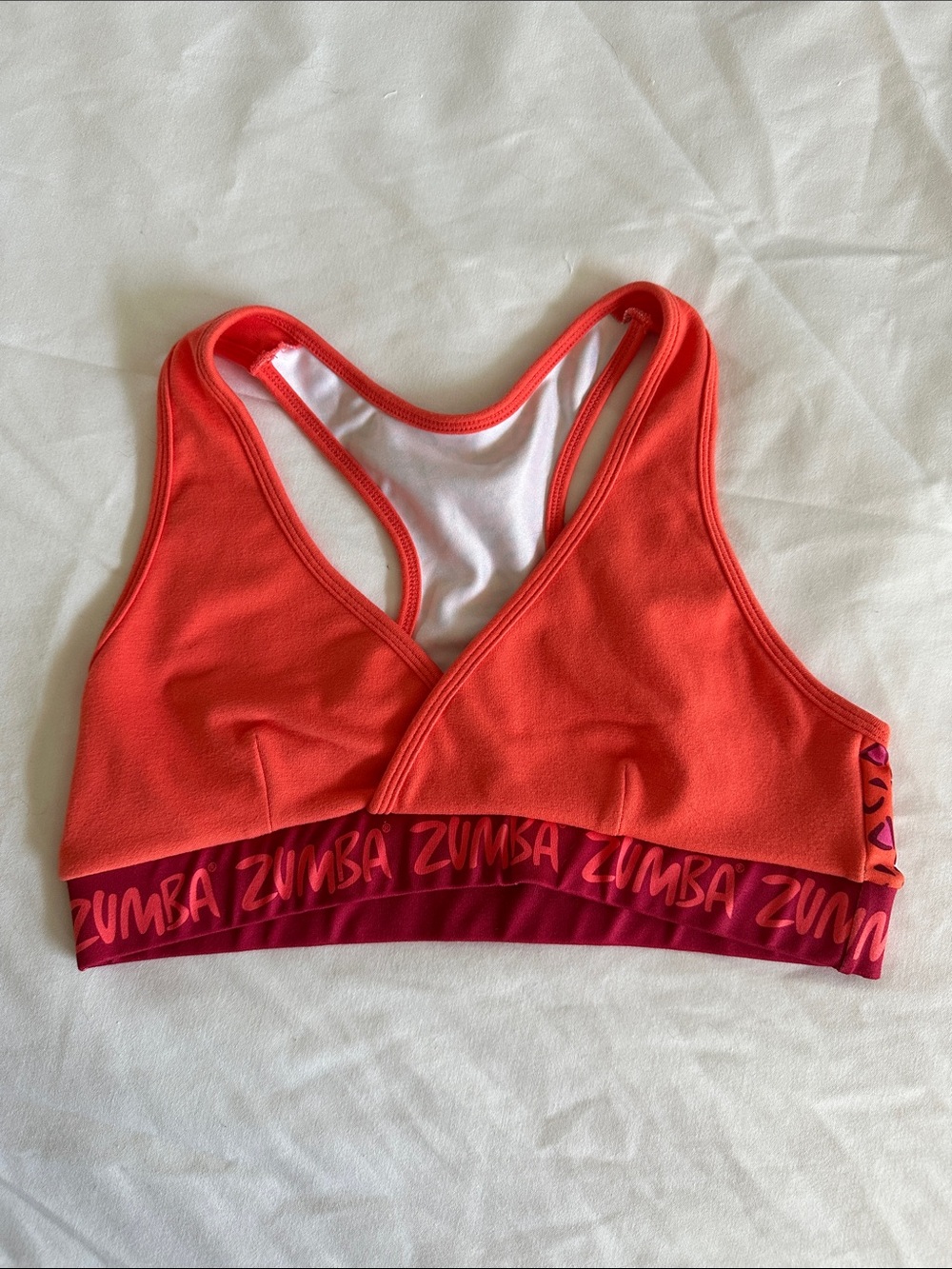 Zumba Fitness Orange Coral Sports Bra with Branded Pink Band